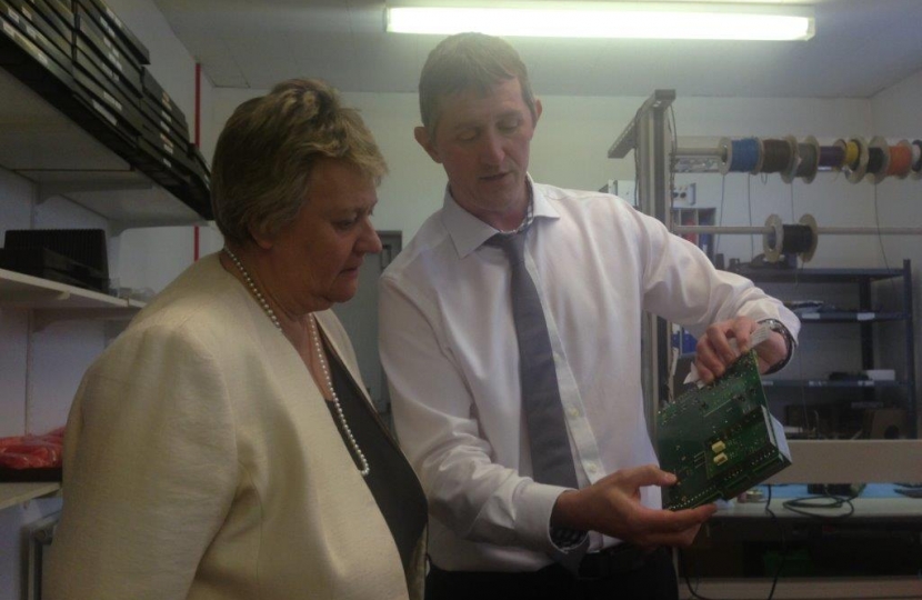 Heather Wheeler MP and Jonathan Portus examining a computer motherboard